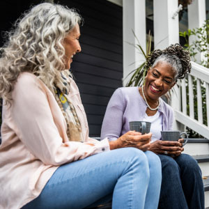 Mature Women Laughing on Porch